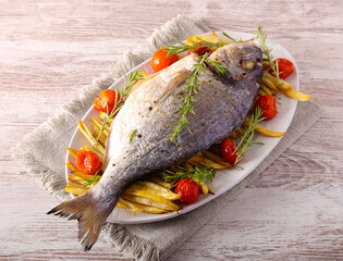 stream bream, dorada fish with beans and tomato