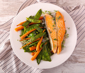 Salmon with baby carrot and pea