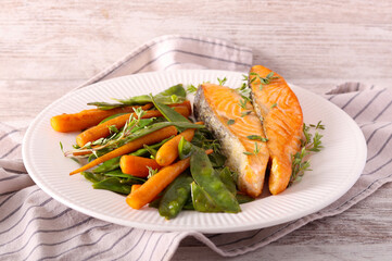 Salmon with baby carrot and pea