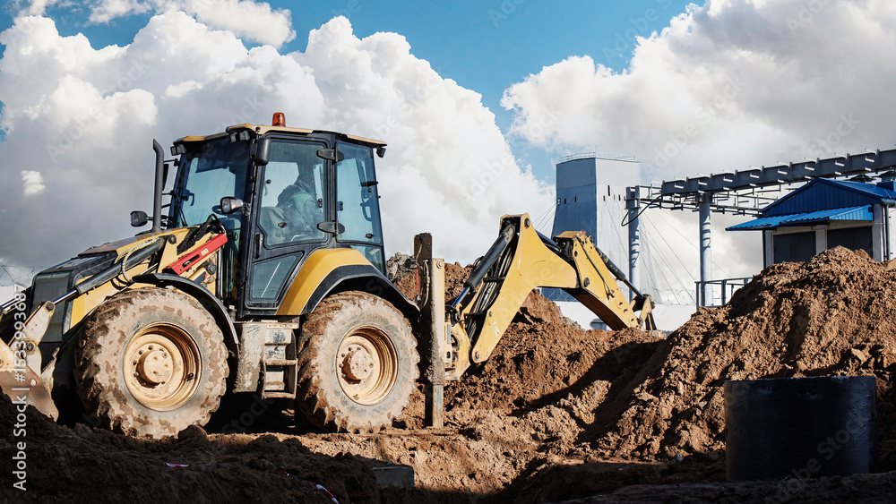 Aufkleber construction machinery works on a building site with clouds in the background during daylight hours