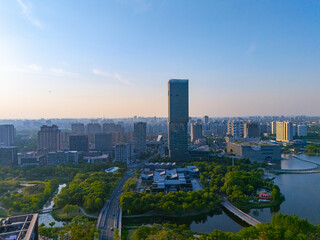 Aerial view of skyscrapers with beautiful lake garden at sunset, Jiading central district, Shanghai.