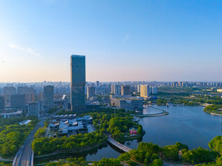 Aerial view of skyscrapers with beautiful lake garden at sunset, Jiading central district, Shanghai.