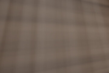 Abstract background with bright rays in shades of brown.