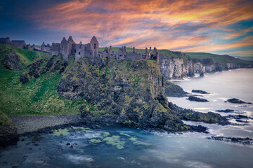 Dunluce Castle at Sunset &ndash; Dramatic Sky and Reflections on the Sea, Northern Ireland