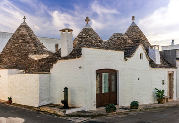 wonderful white mediterranean architecture of italian buildings with sdtrange conic roofs and wfite vintage walls and windows