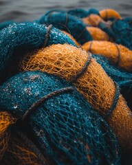 Close-up of tangled fishing nets, teal and ochre
