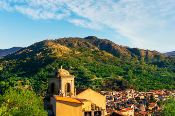 Mountain town view. Mountain landscape of  beautiful village in Sicily, Italy. A town in a beautiful mountain valley. Mountain valley town during sunset in evening light