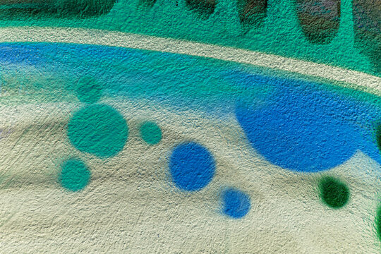 Fototapeta beautiful wallpaper of street wall graffiti painting of aerosol urban art. Colorful city background of spray graffiti drawing in modern culture style