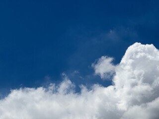 beautiful white clouds in blue sky. fluffy clouds In blue sky. Background nature. Texture cumulus cloud floating on blue sky. Environment concept, Place for an inscription or logo, no pollution