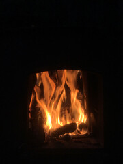 Warm flames flickering in a cozy fireplace during evening hours