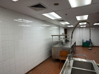 restaurants dishwashing station or dish pit, industrial dishwasher, sink, shelves in a modern cafe
