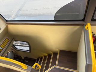  view of the bus stairs inside a top bus