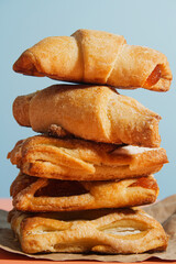 Fresh sweet pastries on a blue background