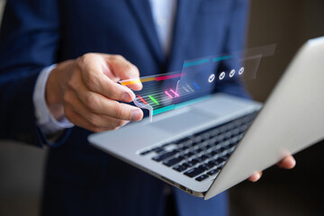 Businessman Analyzing Data on Laptop with Holographic Progress Bar and Checkmarks
