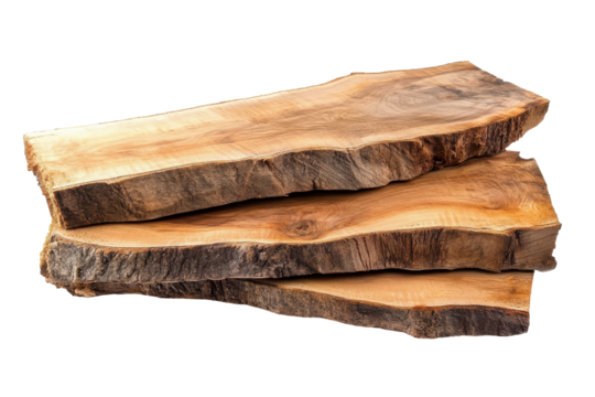 Stacked wooden slabs and planks exhibiting natural grain patterns and textures in a well-lit workspace