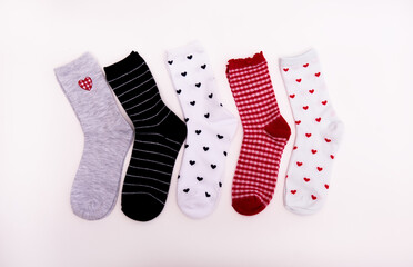 Different socks with hearts are on a white background
