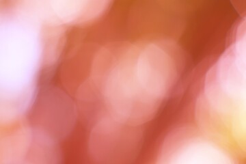 Abstract dreamy background of soft, glowing coral and peach hues