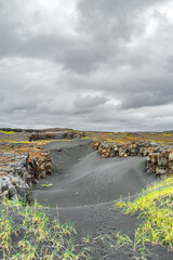 Iceland, Reykjanes peninsula, Miðlína, bridge and canyon between two continents, rough landscape with volcanoes, lava fields, panoramic scenic dramatic view