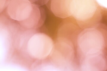 Roseate orbicular luminescence illuminating a softly blurred abstract 