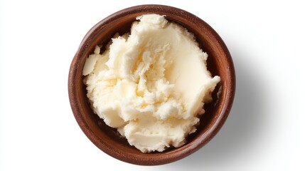 Ultra quality image of top view of a bowl with isolated shea butter on a white background.