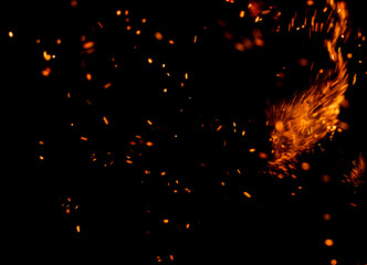 A black background with a lot of fire and smoke