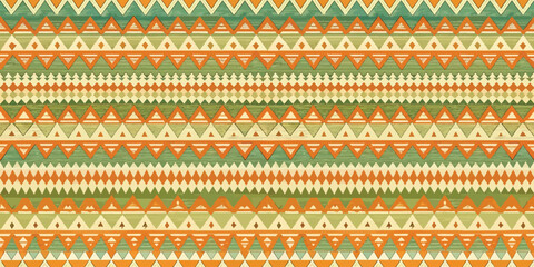Colorful geometric pattern in orange, green, and beige hues.
