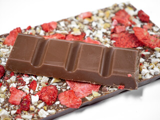 Handmade milk chocolate bar with freeze-dried fruit, strawberry