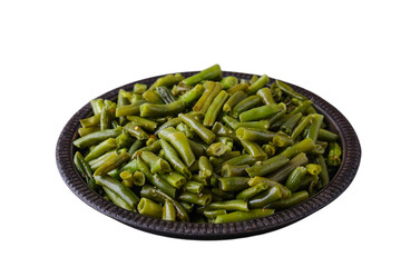 Frying green beans with spices isolated on white
