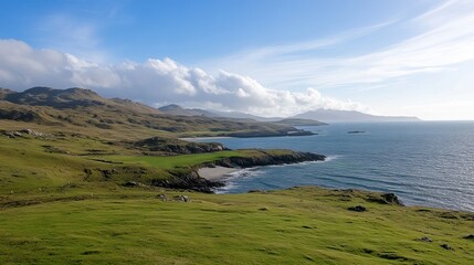 Panoramic coastal view featuring a secluded sandy beach nestled between verdant hills and a calm ocean under a partly cloudy sky