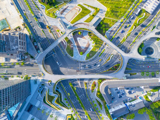 Aerial View of City Crossroads with heavy traffic in Shanghai on sunny day.