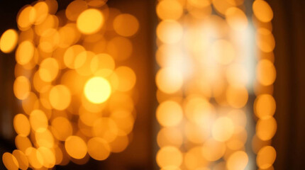 Obraz premium Abstract blurred view of warm yellow lights creating a festive and cozy atmosphere indoors