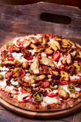 Gyros Pizza with jalapeno pepper, cherry tomatoes and mozzarella cheese. Soft focus. Close up.