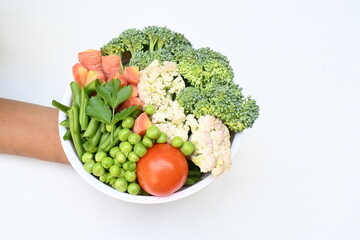 Vibrant medley of fresh vegetables. Features broccoli, cauliflower, tomatoes, Carrot, green beans, and peas. colourful vegetables of spring time, Its good for health. colorful display.
