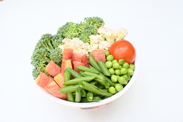 Vibrant medley of fresh vegetables. Features broccoli, cauliflower, tomatoes, Carrot, green beans, and peas. colourful vegetables of spring time, Its good for health. colorful display.