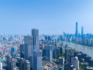 Aerial view of Shanghai skyscraper in downtown with blue sky background.