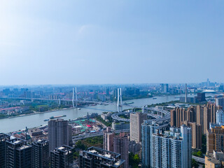 Aerial view of Shanghai skyscraper in downtown with blue sky background.