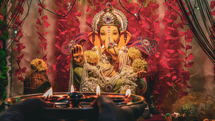 Lord Ganesha Puja: Traditional Diyas Illuminating a Sacred Hindu Celebration