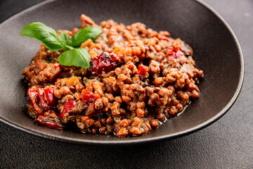 Lentil dish vegetables and roasted peppers savory vegetable fresh vegetarian and vegan food gourmet food background on the table rustic food top view copy space keto and paleo diet