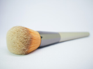 Flat makeup brush with gradient color bristles and grey handle