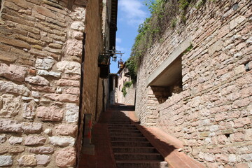 Old medieval narrow streets in Assisi, Italy.
