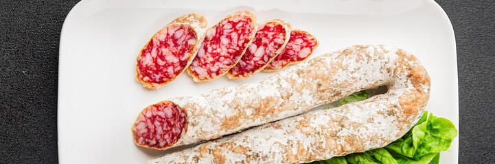 Dry-cured sausage pork meat smoked food fresh delicious gourmet food background on the table rustic...