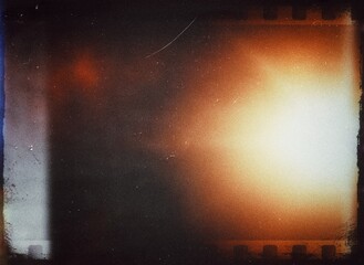 Vintage background with film frame, Abstract grainy film texture with grain and noise, grainy negative filmstrip background, scratched dust damaged old negative film burn