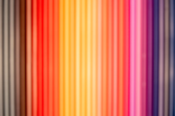 Obraz premium The Photograph of colored pencils arranged in different colors and taken with a blurred focus technique.