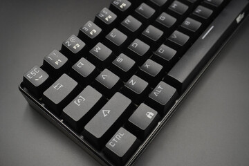 A black mechanical keyboard with a black background
