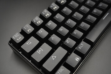 A black mechanical keyboard with a black background