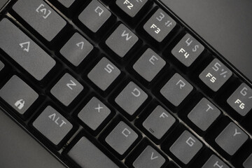 A black mechanical keyboard with a black background