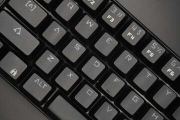 A black mechanical keyboard with a black background