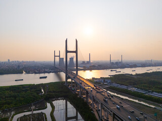 Aerial view of cars on MinPu bridge, The background is a Coal-fired power generation, Shanghai