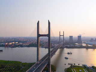 Aerial view of cars on MinPu bridge, The background is a Coal-fired power generation, Shanghai