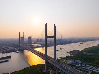 Aerial view of cars on MinPu bridge, The background is a Coal-fired power generation, Shanghai